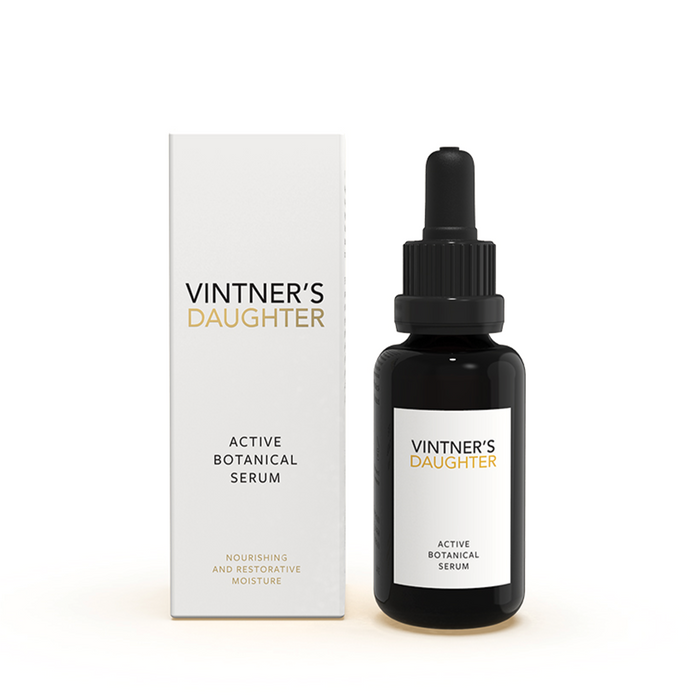Full size 'Active Botanical Serum' by Vintner's Daughter next to a box on a white background
