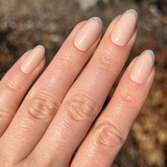Exclamation Point Glitter French Press-Ons | Oval | Medium with nude base and sparkling silver glitter tips for easy at-home mani