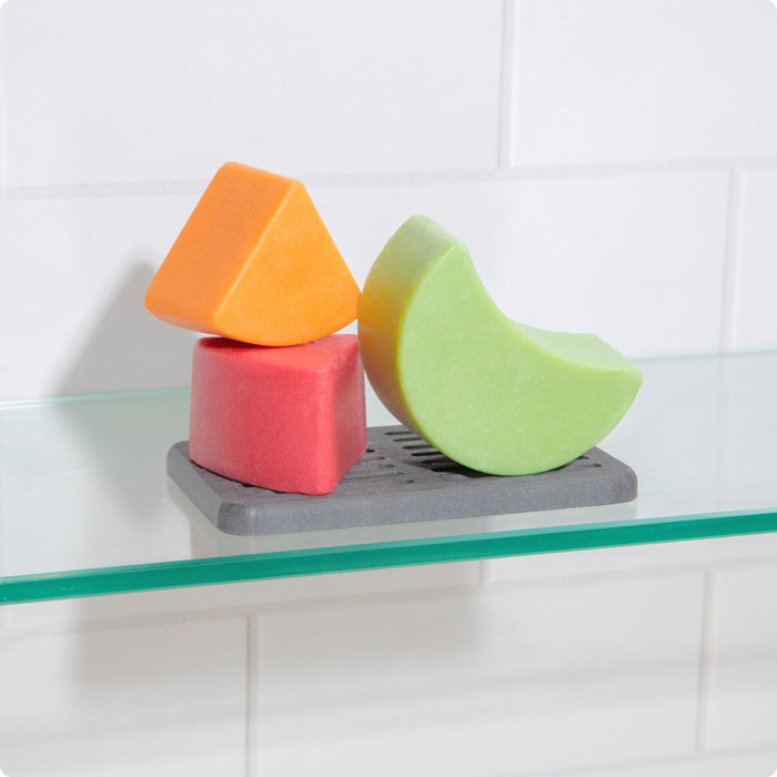 Shampoo and conditioner bars on storage tray