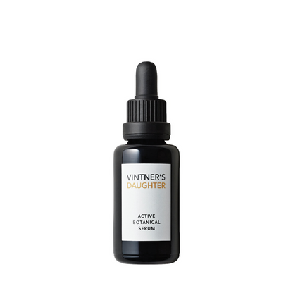 A black bottle with a dropper containing the 'Active Botanical Serum' by Vintner's Daughter, placed against a white background.