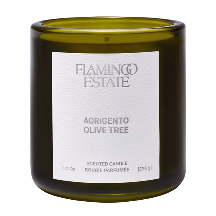 Scented candle with 'Flamingo Estate' label on a white background