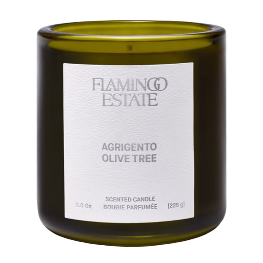 Scented candle with 'Flamingo Estate' label on a white background
