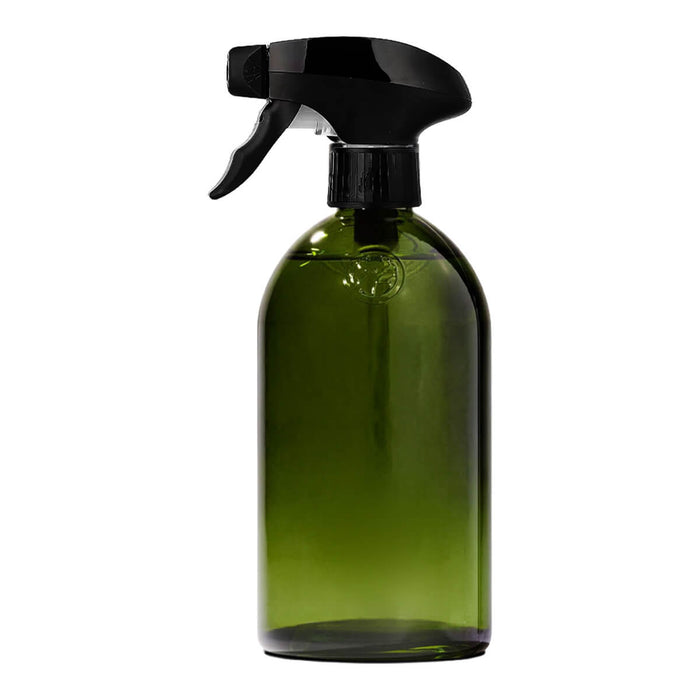 Green apothecary glass bottle with a spray trigger.