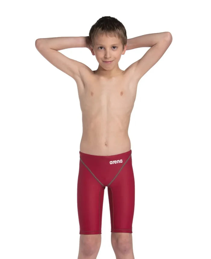 Arena Boys Powerskin ST Next Jammer in deep red, close-up of the competitive swim jammers with sleek fabric and branding details.