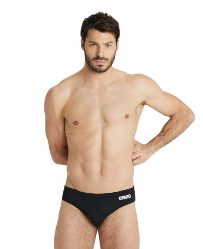 Black Arena men's swim briefs with a solid design, suitable for competitive and recreational swimming.