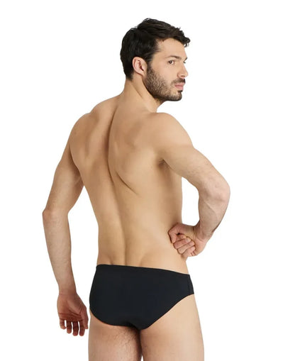 Black Arena men's team swim briefs showing a snug fit, with the Arena logo visible on the waistband.