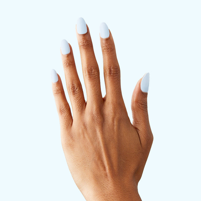 BP - Press-On | Medium | Almond showing a hand with medium almond icy light blue press-on nails in natural light