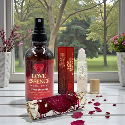 Love Essence energy spray and other products on a windowsill with a view of trees.