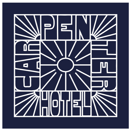 A navy blue bandana with white text and graphic design resembling a sunburst pattern.
