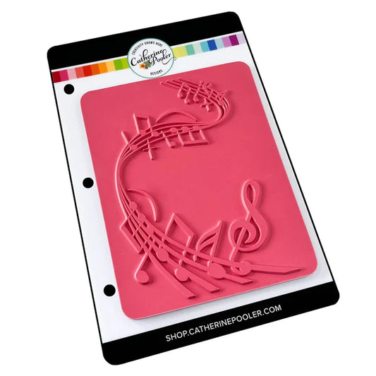 Catherine Pooler - Background Stamp - On Staff. Add some dancing notes to your card background with the On Staff Background Stamp. This red rubber stamp features a winding music staff pattern with notes and musical icons. Available at Embellish Away located in Bowmanville Ontario Canada.