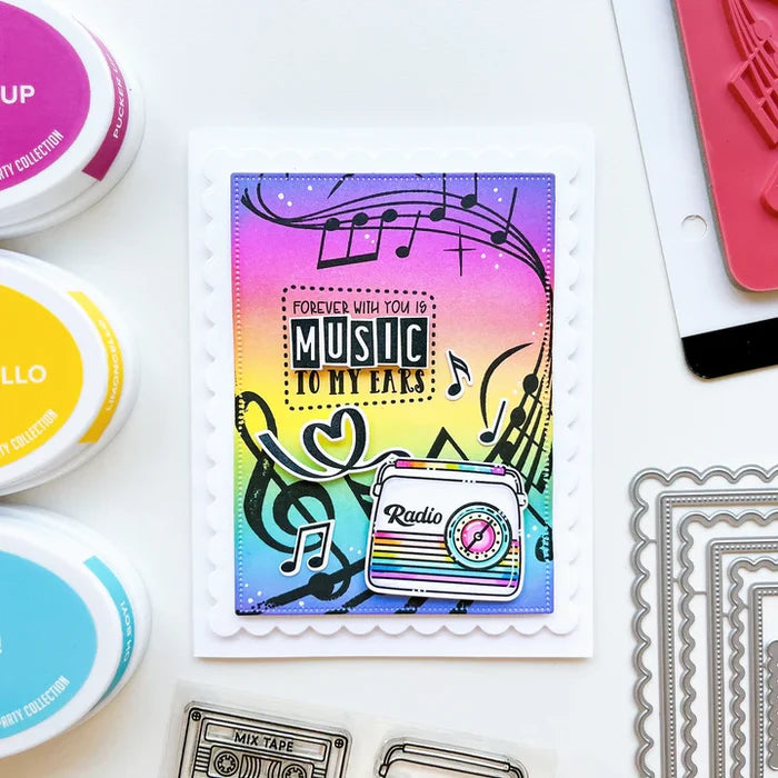 Catherine Pooler - Background Stamp - On Staff. Add some dancing notes to your card background with the On Staff Background Stamp. This red rubber stamp features a winding music staff pattern with notes and musical icons. Available at Embellish Away located in Bowmanville Ontario Canada. Card example by brand ambassador.