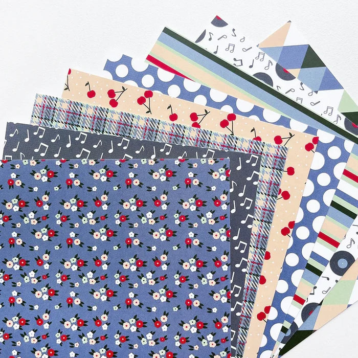 Catherine Pooler - Patterned Paper - Bobby Soxer. The Bobby Soxer Patterned Paper is inspired by life and music of the 1940's. Tweed, tiny flowers and argyle socks- this paper pack has fabric and textile inspired patterns and music inspired prints! Available at Embellish Away located in Bowmanville Ontario Canada.