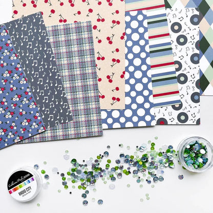 Catherine Pooler - Patterned Paper - Bobby Soxer. The Bobby Soxer Patterned Paper is inspired by life and music of the 1940's. Tweed, tiny flowers and argyle socks- this paper pack has fabric and textile inspired patterns and music inspired prints! Available at Embellish Away located in Bowmanville Ontario Canada.
