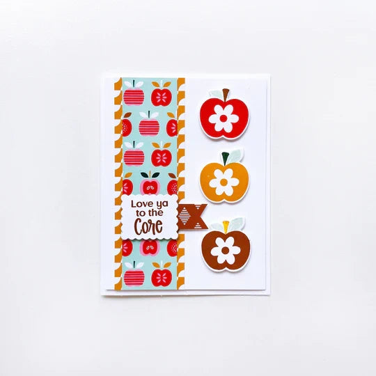 Catherine Pooler - Patterned Paper - Bushel and a Peck. I love this paper....a bushel and a peck! The Bushel and a Peck Patterned Paper features a fun and modern mix of apple prints and fun patterns. Available at Embellish Away located in Bowmanville Ontario Canada. Example by brand ambassador.