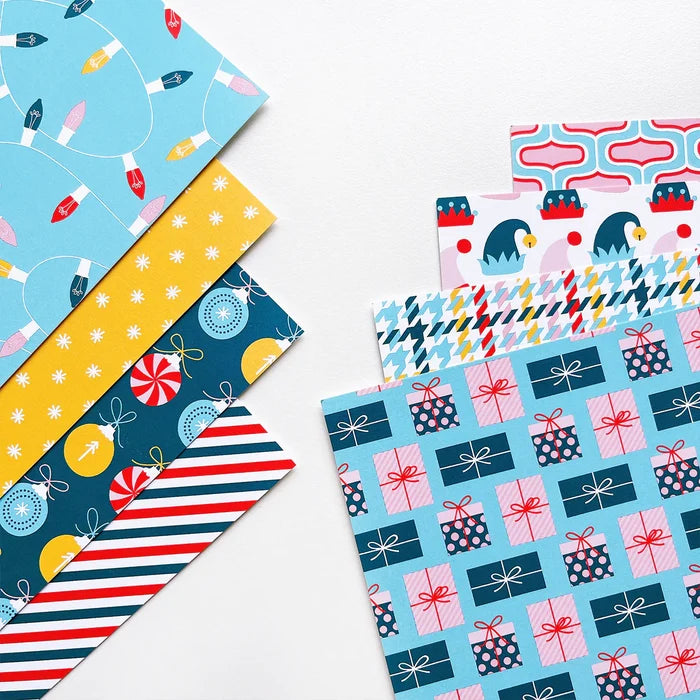 Catherine Pooler - Patterned Paper - Holiday De-Lights. When trimming the tree, don't forget the holiday de-lights! The Holiday De-Lights Patterned Paper is a quintessential holiday mix of patterns and prints! Available at Embellish Away located in Bowmanville Ontario Canada.
