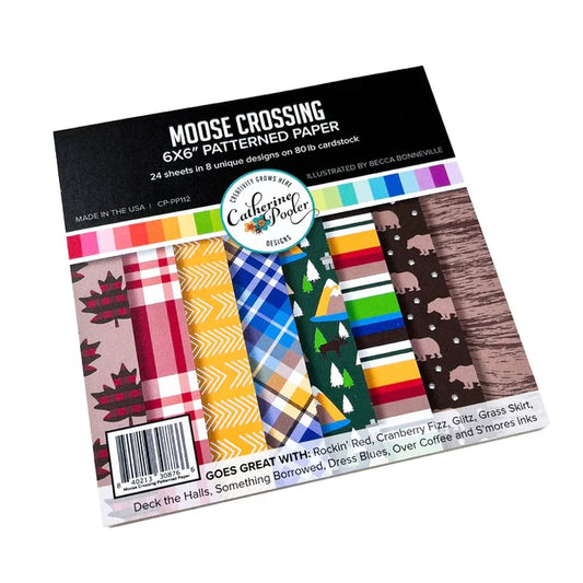 Catherine Pooler - Patterned Paper - Moose Crossing. Oh the beauty of the land and heritage of Canada! The Moose Crossing Patterned Paper celebrates this with patterns including moose, mountains, inuksuks, bears, woodgrain and maple leaves. Available at Embellish Away located in Bowmanville Ontario Canada.