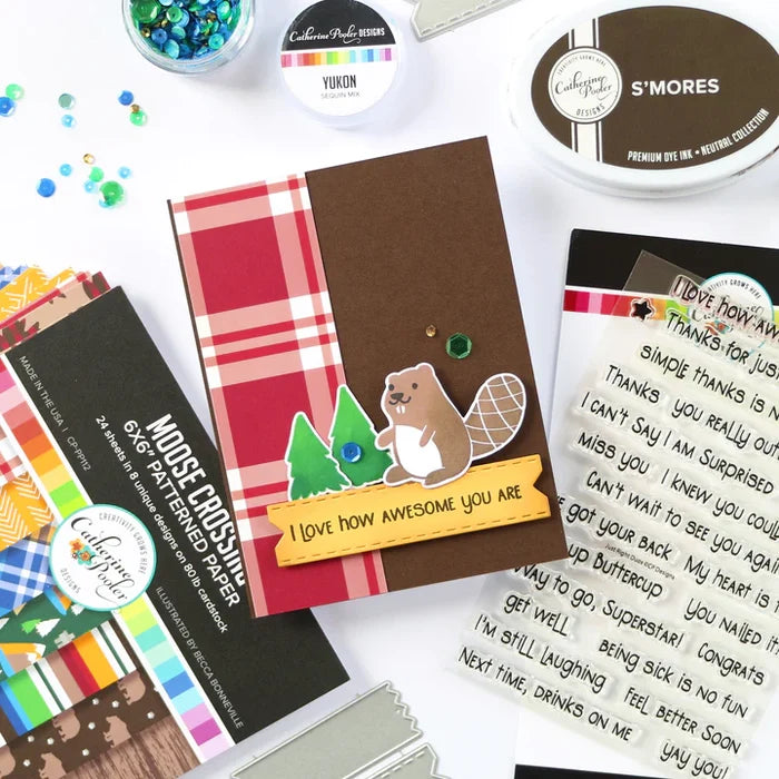 Catherine Pooler - Patterned Paper - Moose Crossing. Oh the beauty of the land and heritage of Canada! The Moose Crossing Patterned Paper celebrates this with patterns including moose, mountains, inuksuks, bears, woodgrain and maple leaves. Available at Embellish Away located in Bowmanville Ontario Canada. card by brand ambassador.