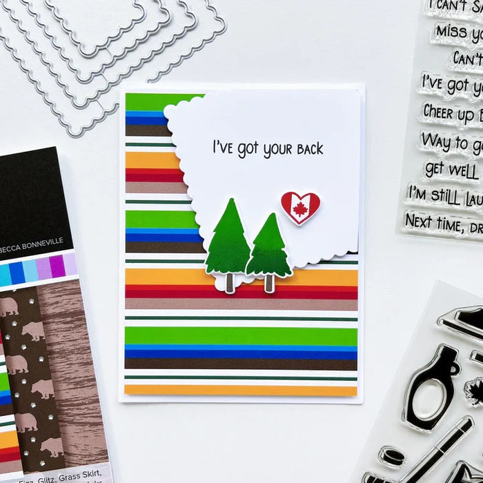 Catherine Pooler - Patterned Paper - Moose Crossing. Oh the beauty of the land and heritage of Canada! The Moose Crossing Patterned Paper celebrates this with patterns including moose, mountains, inuksuks, bears, woodgrain and maple leaves. Available at Embellish Away located in Bowmanville Ontario Canada. card by brand ambassador.