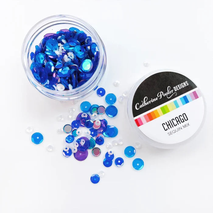 Catherine Pooler - Sequin Mix - Chicago. Home to the World's Fair, Chicago is a city of vibrance and art. This waterside metropolis is the perfect name for our sequin mix, created to coordinate with the fair themed Blue Ribbon Patterned Paper. Available at Embellish Away located in Bowmanville Ontario Canada.