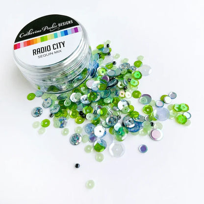 Catherine Pooler - Sequin Mix - Radio City. Approximately 1 Tablespoon mixture packaged in a clear screw top round container. Available at Embellish Away located in Bowmanville Ontario Canada.