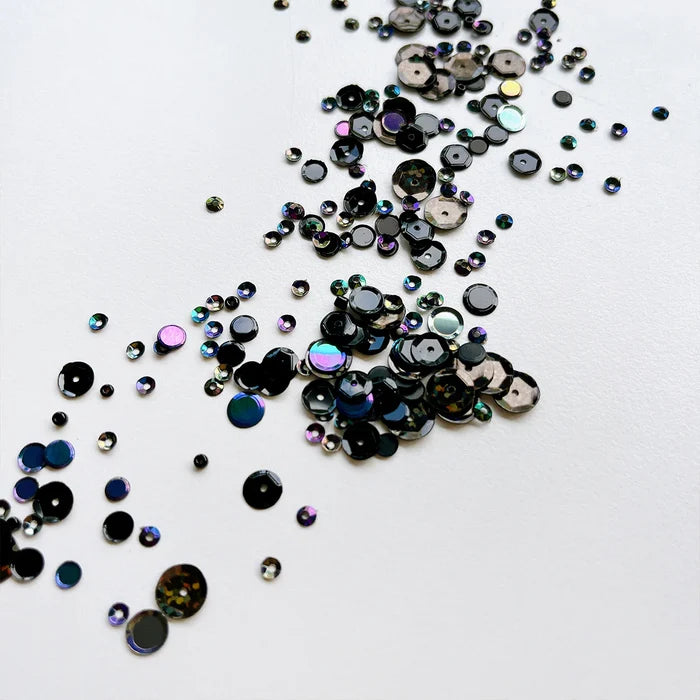 Catherine Pooler - Sequin Mix - Salem Sequin. When you need a class black sequin mix, grab this Salem Mix. Named for the Massachusetts town known for its eerie past, this mix brings the holographic sparkle and iridescent shine. Available at Embellish Away located in Bowmanville Ontario Canada.