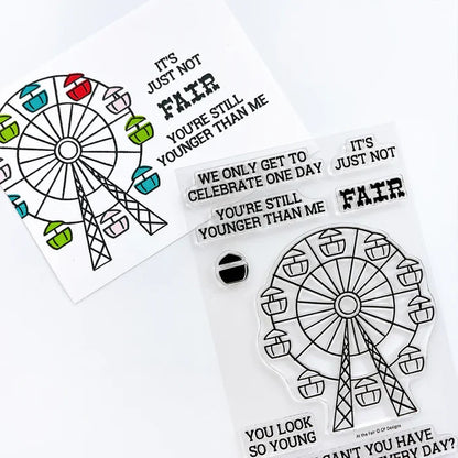 Catherine Pooler - Stamp & Die Set - At the Fair. The icon of the fair coming to town is the Ferris Wheel. The At the Fair Stamp Set and coordinating dies features a Ferris Wheel stamp with a fill in for each car. Available at Embellish Away located in Bowmanville Ontario Canada.