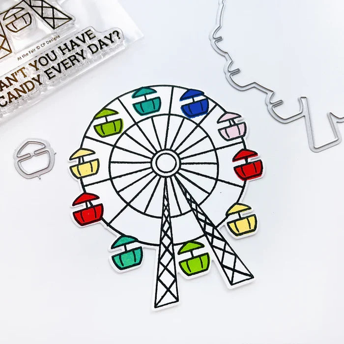 Catherine Pooler - Stamp & Die Set - At the Fair. The icon of the fair coming to town is the Ferris Wheel. The At the Fair Stamp Set and coordinating dies features a Ferris Wheel stamp with a fill in for each car. Available at Embellish Away located in Bowmanville Ontario Canada.