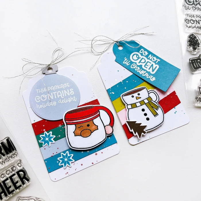 Catherine Pooler - Stamp & Die Set - Holiday Mug. From the makers of the original Mug Shots Stamp Set comes Holiday Mug Shots Stamps and coordinating dies! Features all your favorite winter friends- Santa, Rudolf, Snowman and even the Gingerbread man. Available at Embellish Away located in Bowmanville Ontario Canada. Example by brand ambassador.