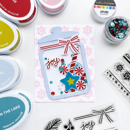 Catherine Pooler - Stamp & Die Set - Jar Full of Joy. Fill your holiday cookie jar with joy! Use the Jar Full of Joy Stamp Set and Coordinating Dies to create your own holiday decor cards! Fill the jar or turn it into a shaker card. Available at Embellish Away located in Bowmanville Ontario Canada. Example by brand ambassador.