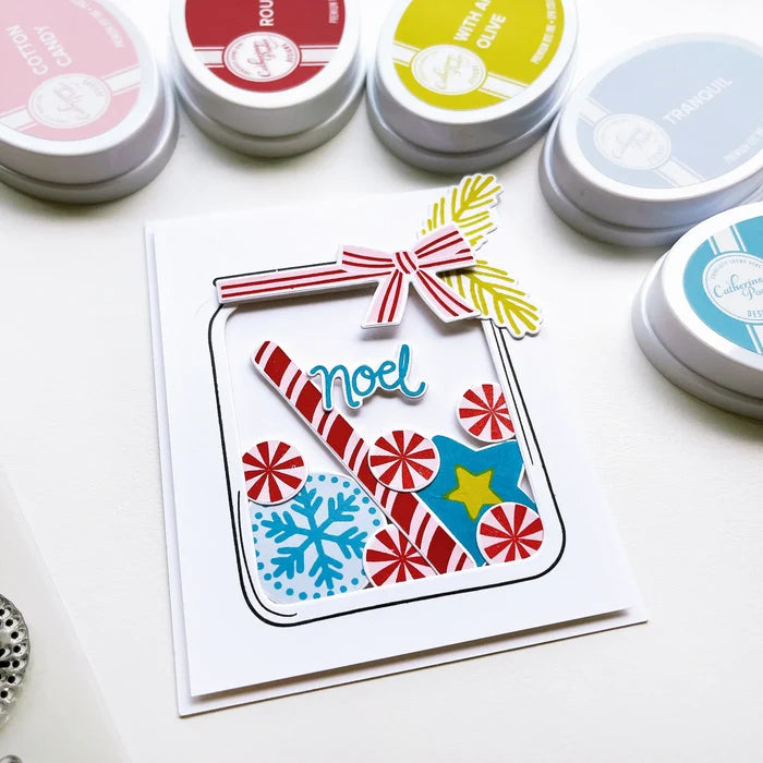 Catherine Pooler - Stamp & Die Set - Jar Full of Joy. Fill your holiday cookie jar with joy! Use the Jar Full of Joy Stamp Set and Coordinating Dies to create your own holiday decor cards! Fill the jar or turn it into a shaker card. Available at Embellish Away located in Bowmanville Ontario Canada. Example by brand ambassador.