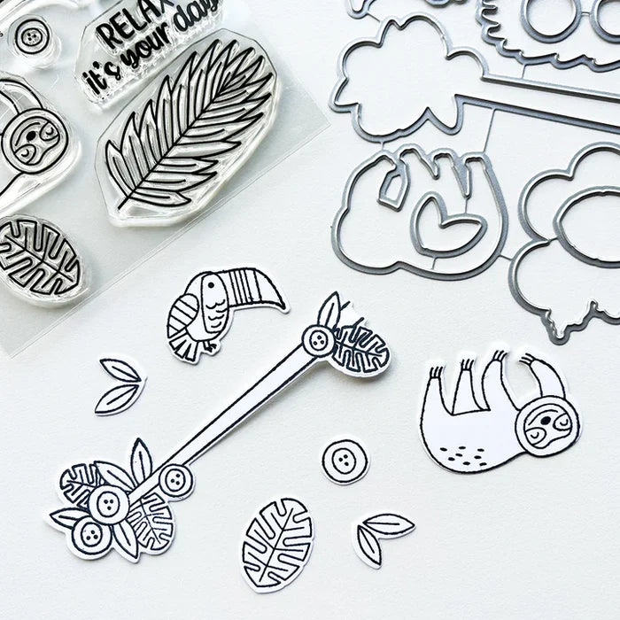 Catherine Pooler - Stamp & Die Set - Jungle Amigos. Send a jungle greeting to your friend and let them know "things are about to get wild"! The Jungle Amigos Set features a happy sloth and his toucan friend who are ready to hang out on your next card. Available at Embellish Away located in Bowmanville Ontario Canada.