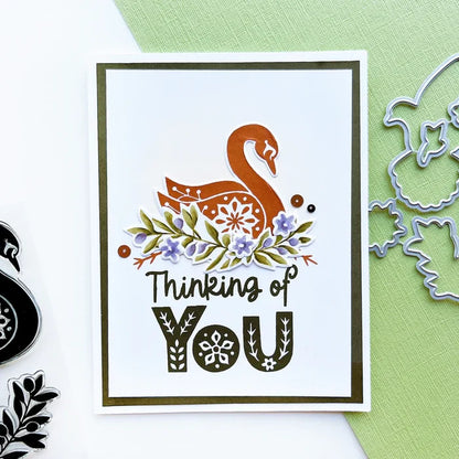 Catherine Pooler - Stamp & Die Set - Peace In Flight. The Peace in Flight Stamp Set features ornately decorated dove and swan stamps to grace your cards. Available at Embellish Away located in Bowmanville Ontario Canada. card example by brand ambassador.