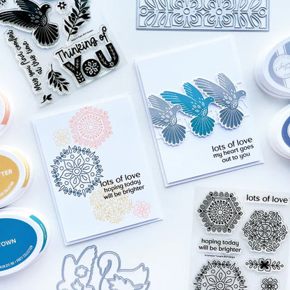 Catherine Pooler - Stamp & Die Set - Peace In Flight. The Peace in Flight Stamp Set features ornately decorated dove and swan stamps to grace your cards. Available at Embellish Away located in Bowmanville Ontario Canada. card example by brand ambassador.