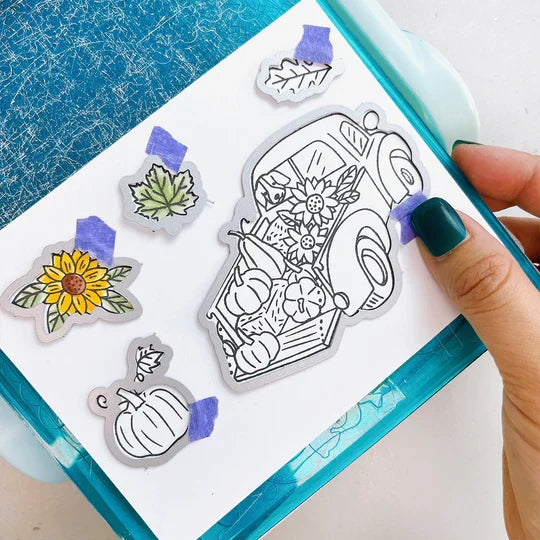 Catherine Pooler - Stamp & Die Set - Pumpkin Pick-Up. Straight from the farm, this Set is the quintessential fall image! Color in this large line art image of a vintage truck filled to the brim with hay, sunflowers and of course- the pumpkins! Available at Embellish Away located in Bowmanville Ontario Canada. Example by brand ambassador.