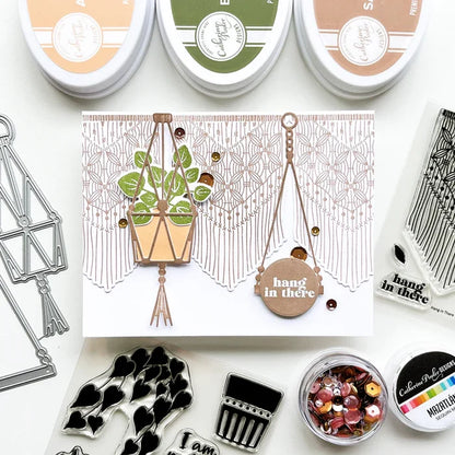 Catherine Pooler - Stamp & Dies Set - Hang in There. When you need to send a little encouragement, do it with the Hang in There Stamp Set. This 3x4 stamp set features a macrame wall hanging stamp and a tiny "hang in there" sentiment. Available at Embellish Away located in Bowmanville Ontario Canada. Card example by brand ambassador.