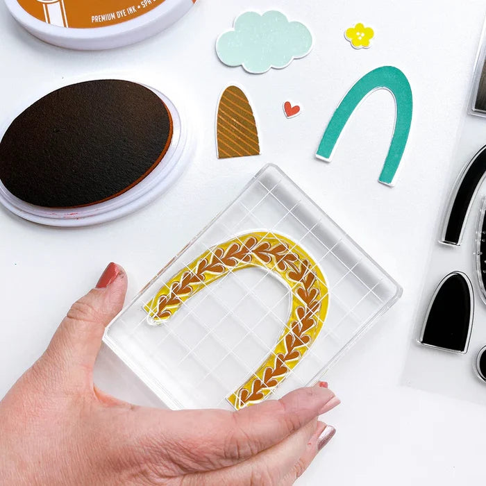 Catherine Pooler - Stamp & Dies Set - Smile Bright. Smile Bright! This 6x8 Stamp Set and coordinating dies are ready for you to piece it together to your hearts content to create a modern, boho rainbow. Available at Embellish Away located in Bowmanville Ontario Canada.