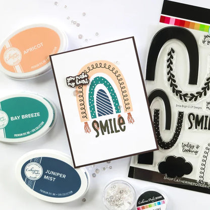 Catherine Pooler - Stamp & Dies Set - Smile Bright. Smile Bright! This 6x8 Stamp Set and coordinating dies are ready for you to piece it together to your hearts content to create a modern, boho rainbow. Available at Embellish Away located in Bowmanville Ontario Canada. Card example by brand ambassador.