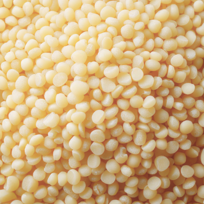 Organic White Beeswax Pellets displayed as small white pellets for skincare and cosmetic formulations