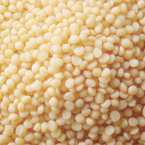 Organic White Beeswax Pellets displayed as small white pellets for skincare and cosmetic formulations
