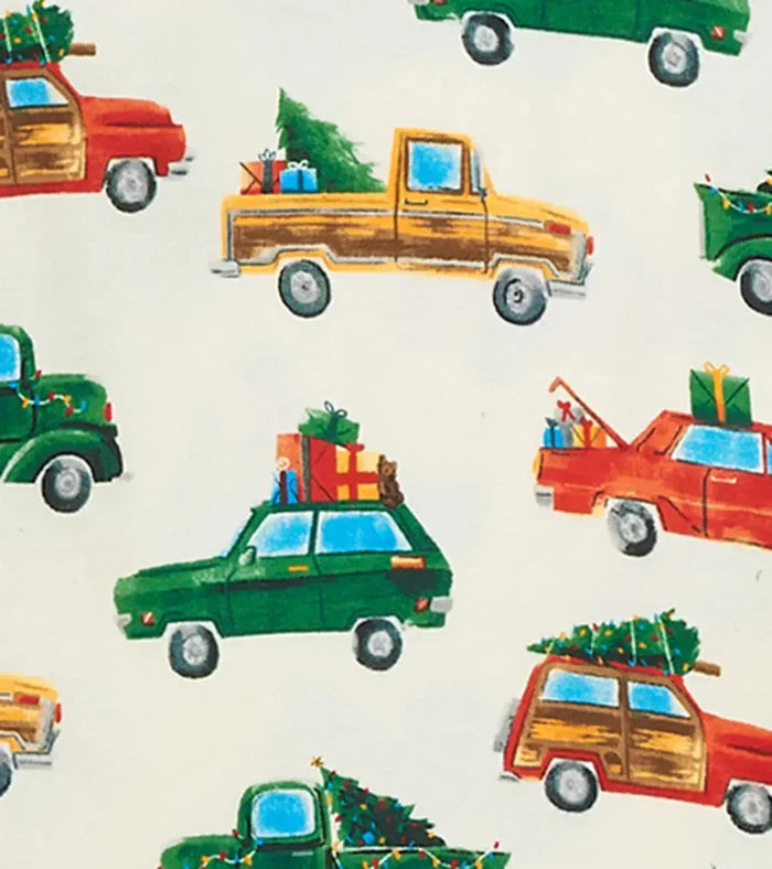 Closeup of Hatley boys Christmas Cars print with holiday cars on ivory organic cotton fabric.