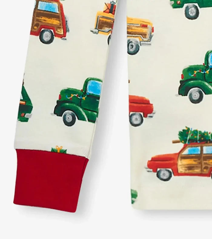 Closeup of Hatley boys pajama pants with red cuff trim and Christmas Cars print.