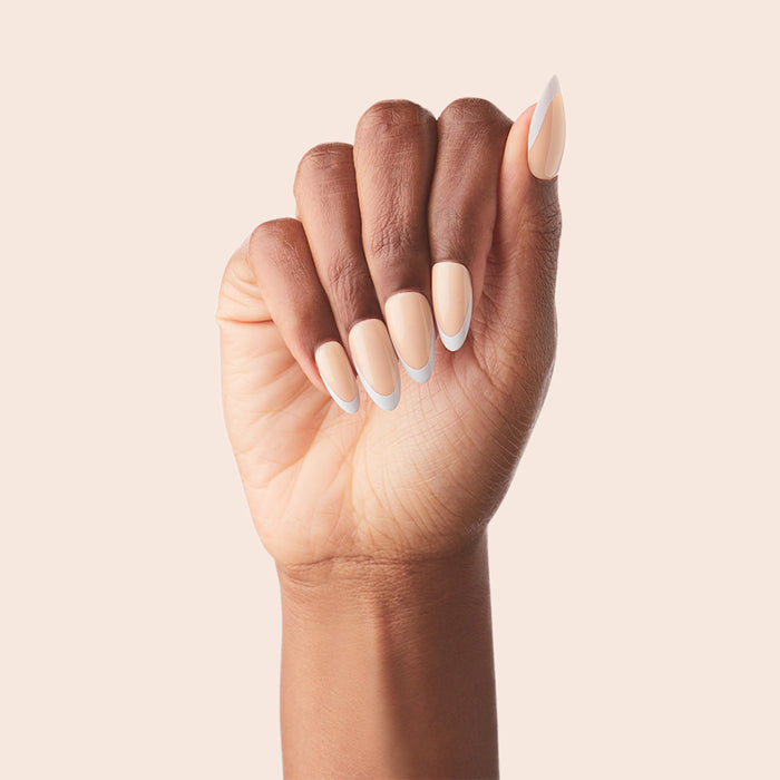 Classic French - Press-On | Medium | Almond showing medium almond false nails with peachy pink base and white tips manicure
