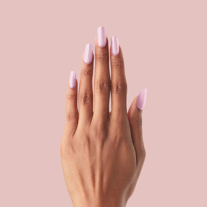 Cockatoo - Press-On | Long | Squoval long false nails in glowing lavender pink shade on hand against soft pink background
