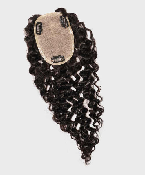 A dark brown, curly hair topper with a mesh base and four black attachment clips, perfect for volume and coverage on white background.