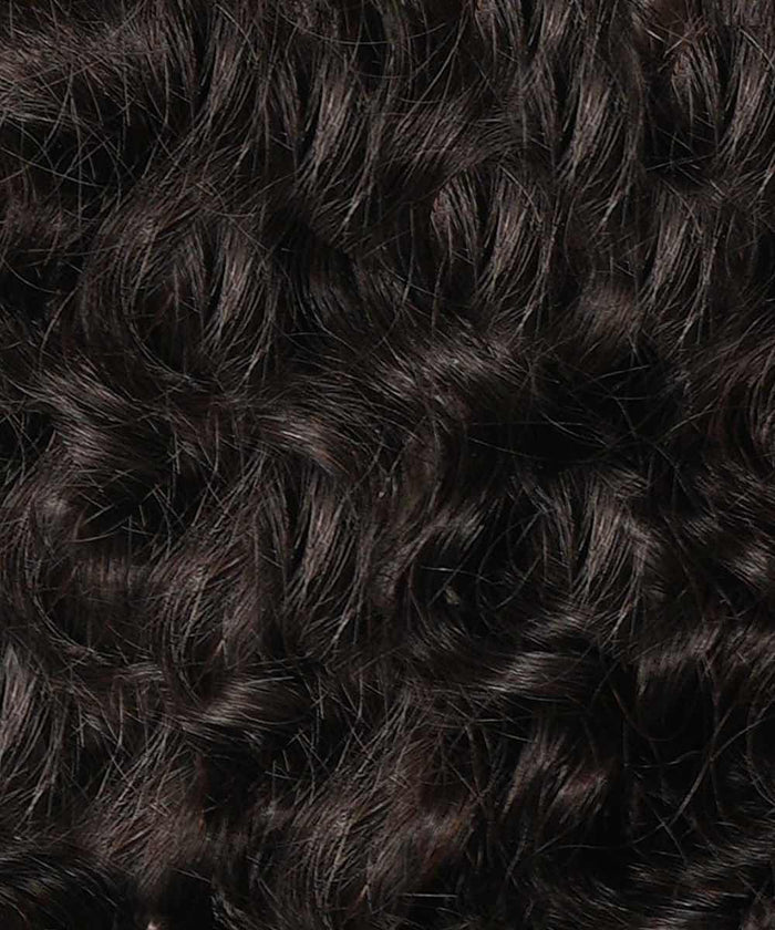 Close-up of dark brown, curly hair with defined, shiny ringlets and a voluminous, textured appearance.