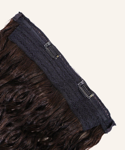 A close-up of Curly Perfect Crown Hair Extensions by Perfect Locks in golden brown , with black lace and two clips on a light background.#color_natural-black-(1B)