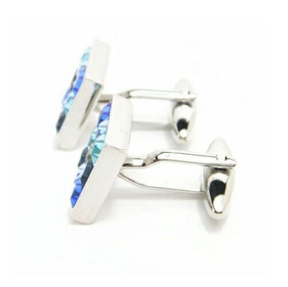 Rhodium-plated square cufflinks with blue Swarovski crystals displaying sophisticated design and craftsmanship.