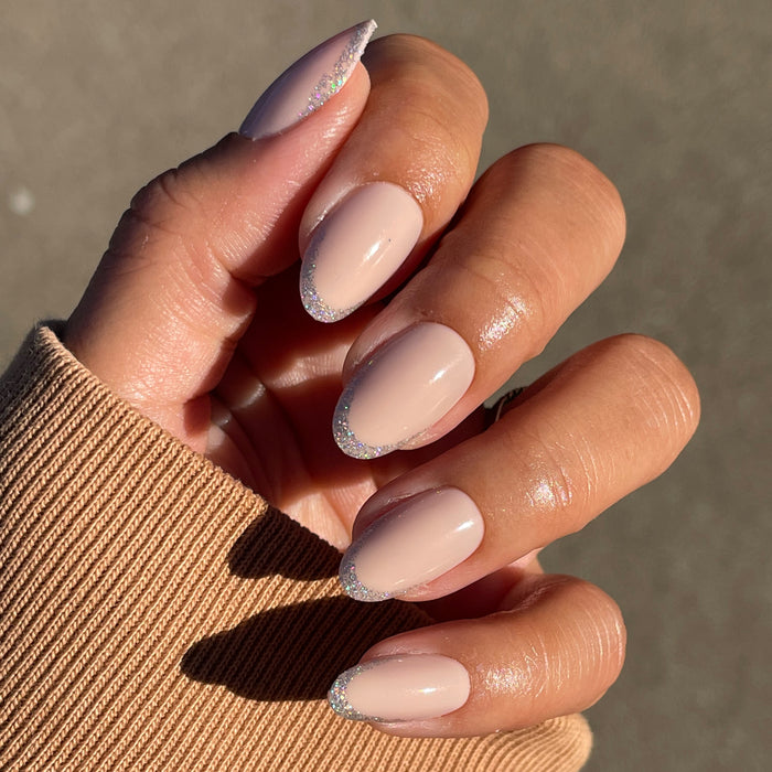 Exclamation Point Glitter French Press-Ons | Oval | Medium with nude base and subtle silver glitter tips for quick mani