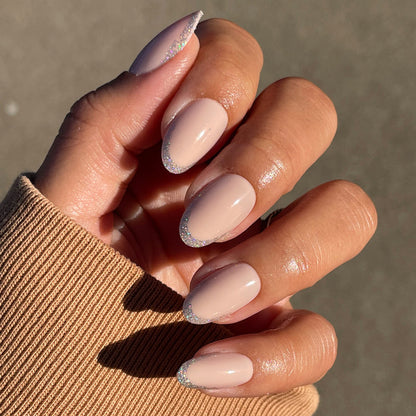 Exclamation Point Glitter French Press-Ons | Oval | Medium with nude base and subtle silver glitter tips for quick mani