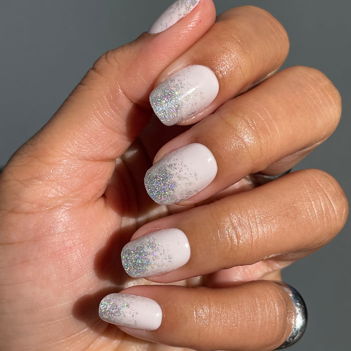 Exclamation Point Glitter Gradient Press-Ons | Squoval | Short with neutral Bunny Slope base and silver sparkly gradient on short faux nails